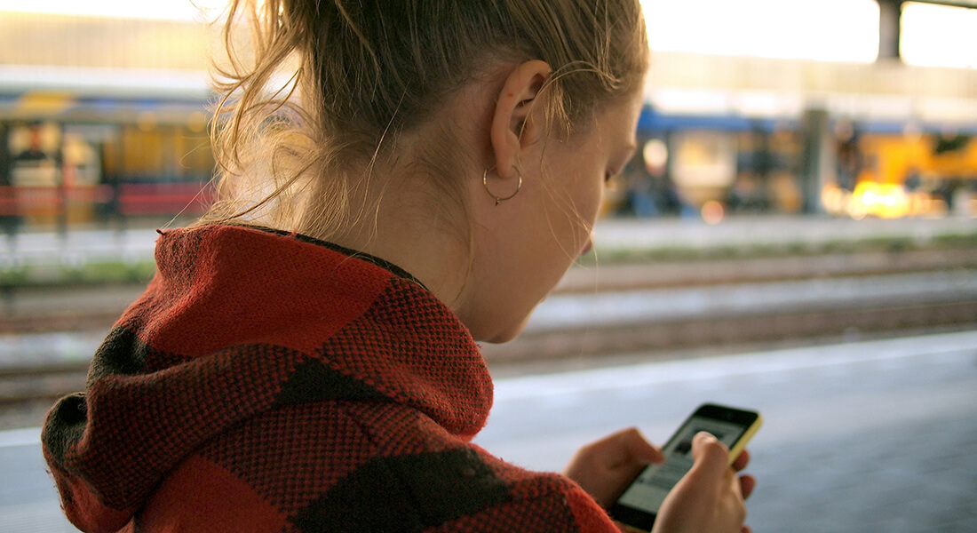 Woman with mobile phone. Photo: Daria Nepriakhina, Unsplash